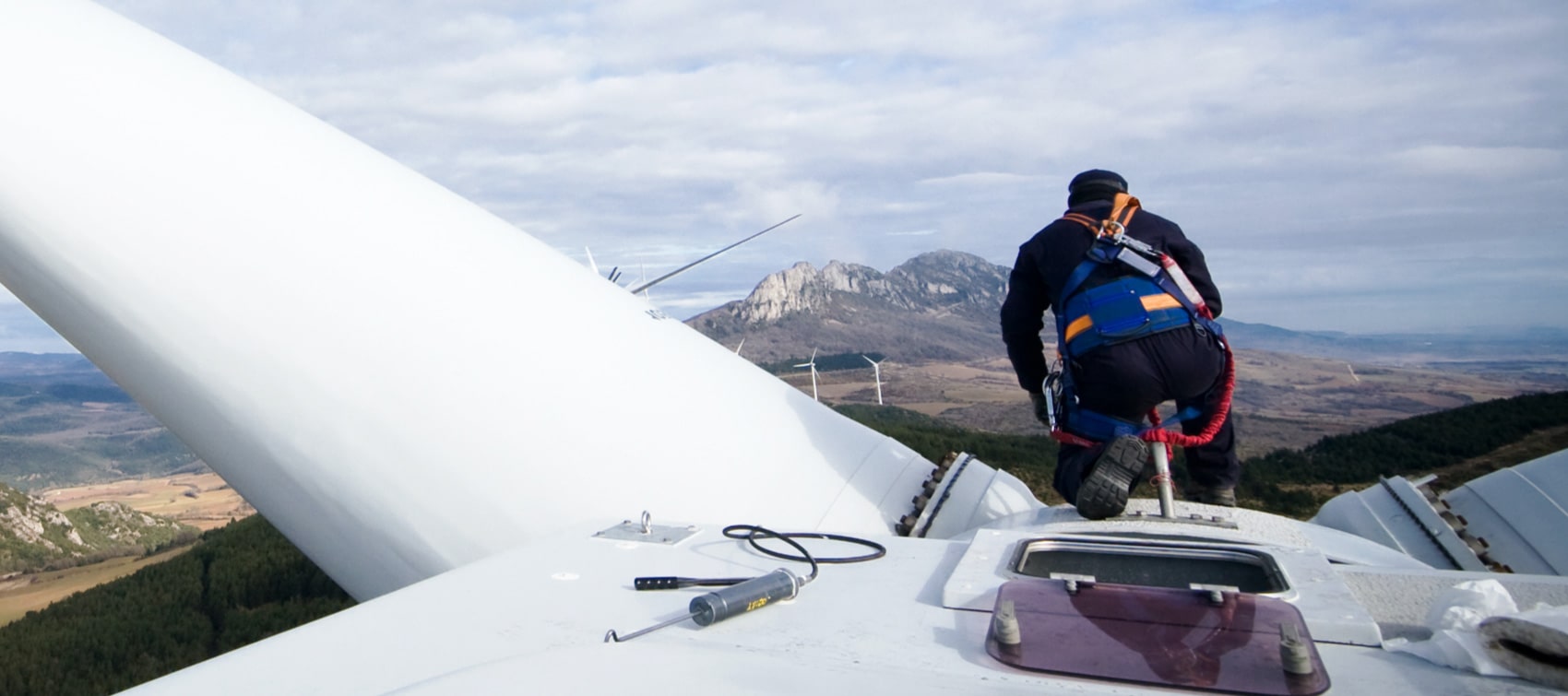 Worker fixing a windwheel