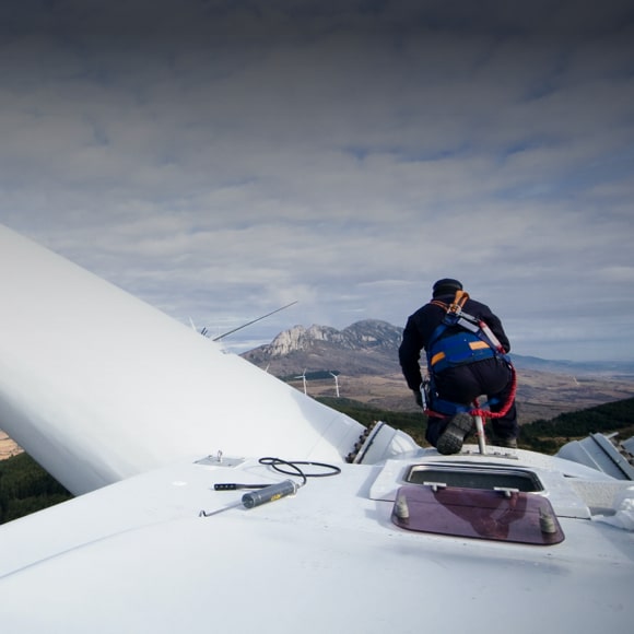 Worker fixing a windwheel